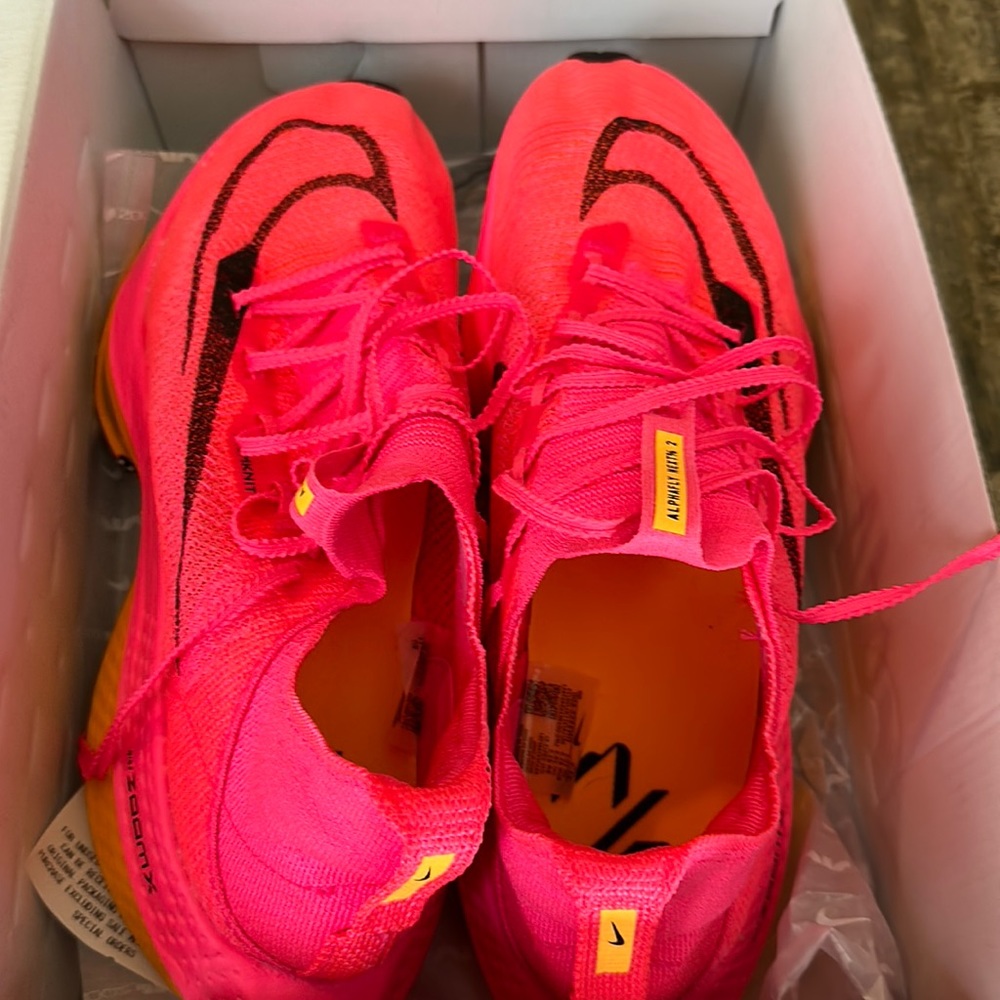 Men’s Nike air zoom pink orange shoes.